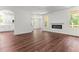 Open-concept living room with hardwood floors and fireplace at 121 Quarterhorse Dr, Louisburg, NC 27549