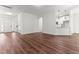 Open-concept living room showcasing hardwood floors, great natural light, and seamless flow to the kitchen at 121 Quarterhorse Dr, Louisburg, NC 27549