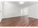 Open-concept living room featuring wood-look floors, and neutral wall colors at 121 Quarterhorse Dr, Louisburg, NC 27549