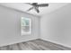 Bright bedroom with new flooring and plenty of natural light at 1213 Grant St, Durham, NC 27701