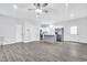 Open concept living room with new flooring and access to the modern kitchen at 1213 Grant St, Durham, NC 27701