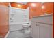 Bathroom featuring orange walls, a white tub, a toilet, and a vanity at 136 Durie Way, Garner, NC 27529