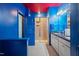 Bathroom with a walk-in shower, double vanity, blue walls, and gray tile floors at 136 Durie Way, Garner, NC 27529