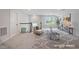 Bright loft space with a cozy seating area, a window, and neutral carpeting at 136 Durie Way, Garner, NC 27529