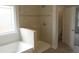 Bright bathroom features a tiled shower, separate tub, and a window for natural light at 15 Decatur Dr, Fuquay Varina, NC 27526