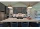 Kitchen with modern finishes, an island with bar seating, and a marble countertop with stainless steel faucet at 16 Calming Pl Pl, Fuquay Varina, NC 27526