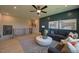 Upstairs sitting room with gray furniture, neutral paint, and modern light fixture at 16 Calming Pl Pl, Fuquay Varina, NC 27526