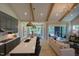 Spacious open layout featuring the kitchen island, dining area, and living room with access to the patio at 16 Calming Pl Pl, Fuquay Varina, NC 27526