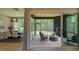 View from the interior out to the back patio and outdoor fireplace, as well as the nearby dining room at 16 Calming Pl Pl, Fuquay Varina, NC 27526