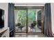 Inviting balcony with sliding glass doors and seating, perfect for enjoying the wooded view at 1851 Trailwood Heights Ln # 201, Raleigh, NC 27603