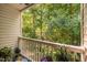 Balcony view overlooking a peaceful wooded area, surrounded by lush greenery at 1851 Trailwood Heights Ln # 201, Raleigh, NC 27603