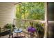 This serene balcony space features seating and lush greenery, overlooking a peaceful wooded area at 1851 Trailwood Heights Ln # 201, Raleigh, NC 27603