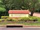 Trailwood Heights community sign set amongst landscaped plantings at 1851 Trailwood Heights Ln # 201, Raleigh, NC 27603