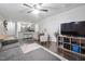 Open concept living room with ceiling fan, hardwood floors, and view of kitchen at 1851 Trailwood Heights Ln # 201, Raleigh, NC 27603