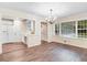 Dining room with wood floors, large window, and chandelier at 201 Shady Lane Dr, Smithfield, NC 27577