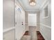 Inviting entryway with elegant finishes, neutral color palette, and durable hardwood flooring at 201 Shady Lane Dr, Smithfield, NC 27577