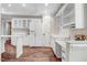 Bright kitchen with wood floors and white appliances at 201 Shady Lane Dr, Smithfield, NC 27577