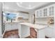 Kitchen featuring white cabinets, an island, and stainless steel appliances at 201 Shady Lane Dr, Smithfield, NC 27577