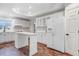 Kitchen with white cabinets, center island, and stainless steel appliances at 201 Shady Lane Dr, Smithfield, NC 27577
