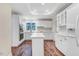 Kitchen with an island, white cabinets and plenty of natural light at 201 Shady Lane Dr, Smithfield, NC 27577