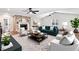 Bright living room featuring a stone fireplace, ceiling fans, and stylish furniture at 201 Shady Lane Dr, Smithfield, NC 27577