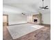 Spacious living room features a stone fireplace, ceiling fans, and hardwood floors at 201 Shady Lane Dr, Smithfield, NC 27577