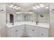 Bright main bathroom featuring dual sink vanity and large mirrors with great lighting at 201 Shady Lane Dr, Smithfield, NC 27577