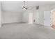 Large main bedroom with lots of space, vaulted ceiling, neutral carpeting, and two entry doors at 201 Shady Lane Dr, Smithfield, NC 27577