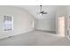 Spacious main bedroom featuring vaulted ceiling, fan, and windows letting in lots of natural light at 201 Shady Lane Dr, Smithfield, NC 27577