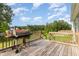Wooden deck with a rustic grill, perfect for outdoor cooking with scenic views at 2040 Alderman Way, Creedmoor, NC 27522