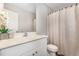 Bathroom featuring a white vanity, ample lighting, and a combination shower-tub at 2040 Alderman Way, Creedmoor, NC 27522