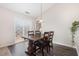Cozy dining area features a rustic wood table, wood-look floors, and sliding glass doors at 2040 Alderman Way, Creedmoor, NC 27522