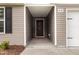 The front door featuring a welcome home sign at 2040 Alderman Way, Creedmoor, NC 27522