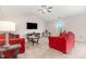 Bright living room with large windows, neutral carpet and comfortable seating at 2040 Alderman Way, Creedmoor, NC 27522