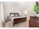 Main bedroom featuring a well-made bed and ensuite bath at 2040 Alderman Way, Creedmoor, NC 27522