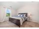 Comfortable bedroom with carpet, natural light, and views of the outdoors at 2040 Alderman Way, Creedmoor, NC 27522