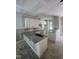 New kitchen featuring granite countertops, white cabinets, and stainless steel sink at 207 S Main St # A, Four Oaks, NC 27524