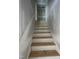 A new staircase with a blank canvas awaiting finishing touches, such as paint, stain, or floor covering at 207 S Main St # B, Four Oaks, NC 27524