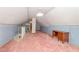 Attic space featuring plush carpet and a desk with blue accented wallpaper at 2129 Wrenn St, Burlington, NC 27215