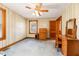 This bedroom is a classic design with wood paneled walls and carpeted floors at 2129 Wrenn St, Burlington, NC 27215