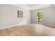 Inviting bedroom with hardwood floors, bright window, and closet space, providing a comfortable living space at 232 Clancy Cir, Cary, NC 27511