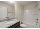 Standard bathroom features granite countertops and tiled shower and bathtub at 236 Lynchwick Ln, Durham, NC 27703