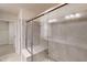 Spacious bathroom with shower featuring large glass doors and tiled bench at 236 Lynchwick Ln, Durham, NC 27703