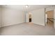 Spacious bedroom with carpeted floors and access to bathroom and hallway at 236 Lynchwick Ln, Durham, NC 27703
