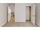 Empty bedroom features neutral carpeting, and two doors at 236 Lynchwick Ln, Durham, NC 27703