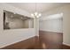 Bright dining area boasts hardwood floors, stylish chandelier and an open layout at 236 Lynchwick Ln, Durham, NC 27703