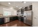 Stylish kitchen featuring stainless steel appliances and backsplash detail at 236 Lynchwick Ln, Durham, NC 27703