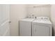Practical laundry room featuring a washer and dryer for convenience at 236 Lynchwick Ln, Durham, NC 27703