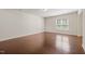 Empty room features neutral walls, hardwood floors and a large window at 236 Lynchwick Ln, Durham, NC 27703