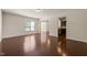 Bright living room featuring hardwood floors and an open layout to the kitchen at 236 Lynchwick Ln, Durham, NC 27703